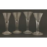 A composed set of four drinking glasses,