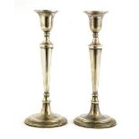 A pair of silver candlesticks