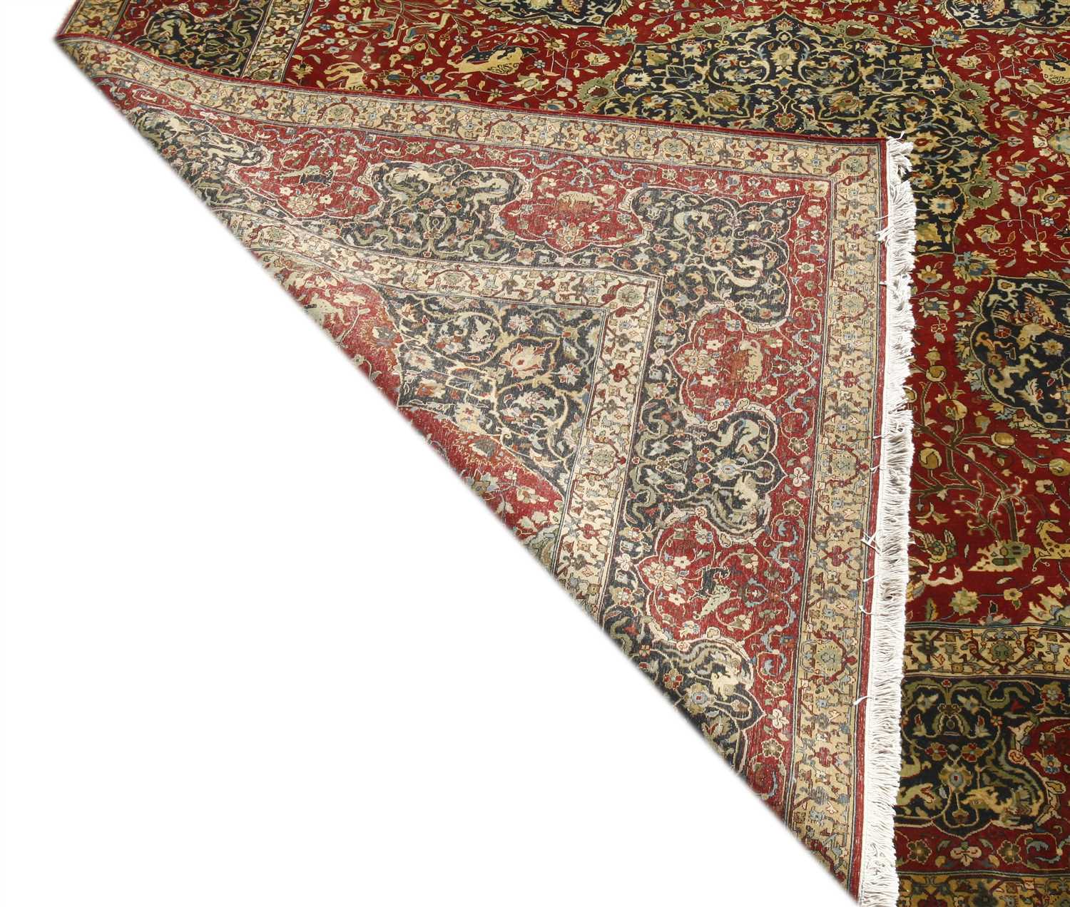A Persian design woollen carpet, - Image 2 of 2