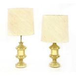 A pair of brass table lamps,