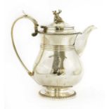 A George lV silver hot water jug
