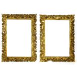 A pair of large carved giltwood frames