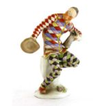 A Meissen figure of an harlequin,