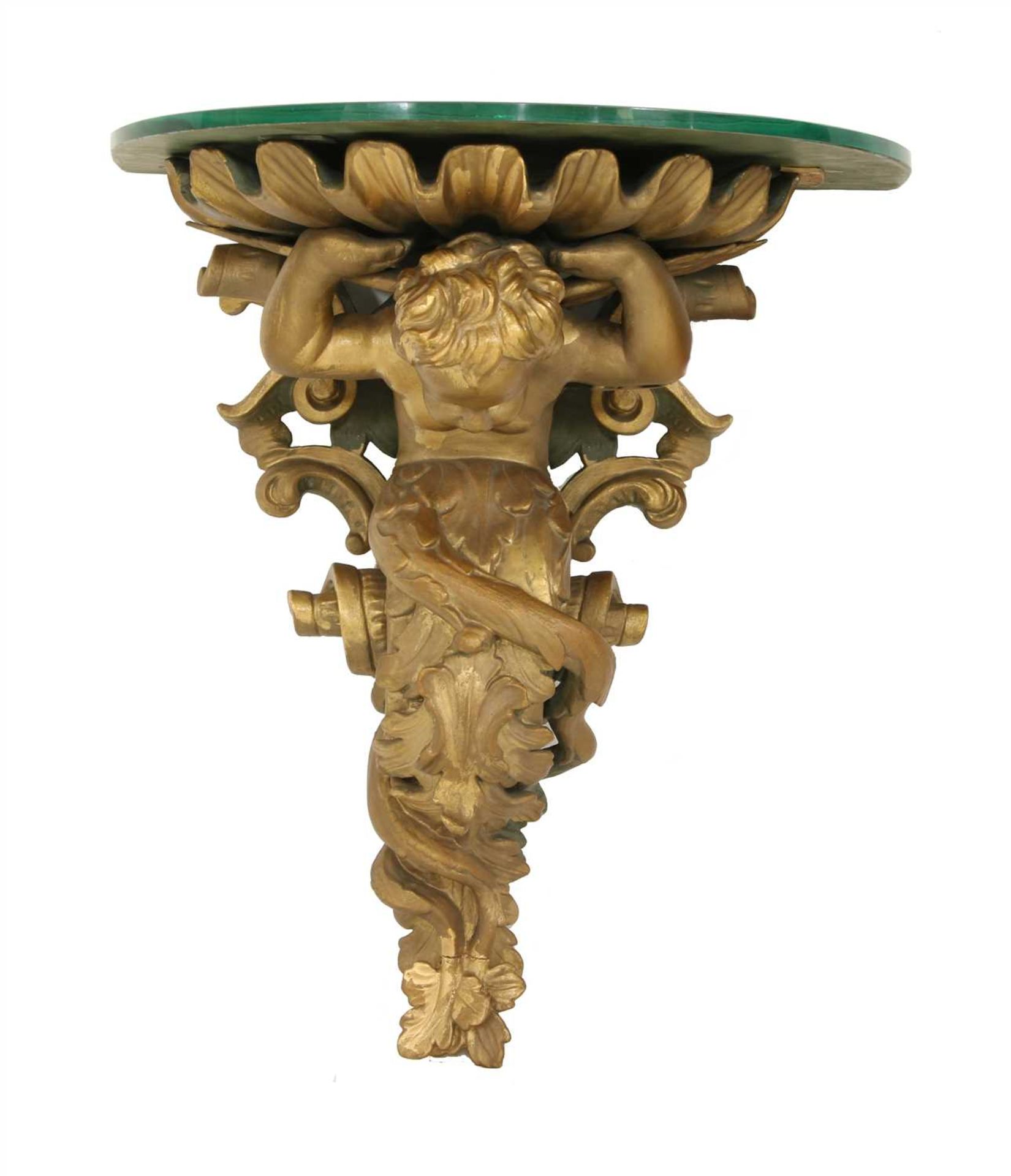 A carved wooden and composite wall bracket,
