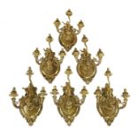 Six three-branch gilt metal wall lights