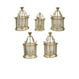 A set of four George III-style brass hall lanterns