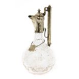 A silver-mounted cut glass claret jug