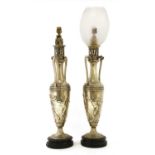 A pair of silver-plated oil lamps