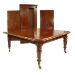 A Victorian mahogany extending dining table