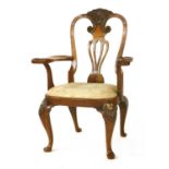 An American walnut open armchair,