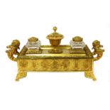 A gilt bronze desk stand