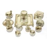 Eleven silver-mounted glass inkwells,