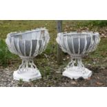 A pair of rare Victorian painted cast and wrought iron planters,