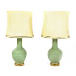 A pair of large celadon glazed table lamps,