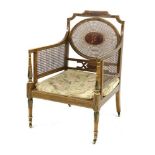 A Victorian Howard & Sons painted bergère armchair,
