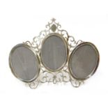 An unusual late Victorian triple photograph frame,