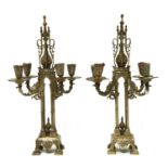 A pair of four-branch bi-metal candelabra,