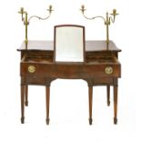 A George III mahogany serpentine dressing table,