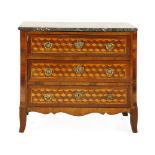 A Louis XVI parquetry inlaid commode