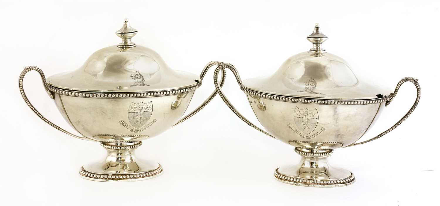 A pair of George III silver sauce tureens and covers,