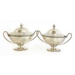 A pair of George III silver sauce tureens and covers,