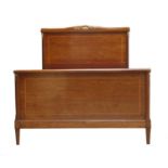 A French Empire-style strung mahogany double bed,