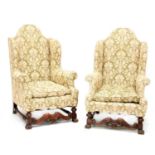 A pair of elbow chairs,