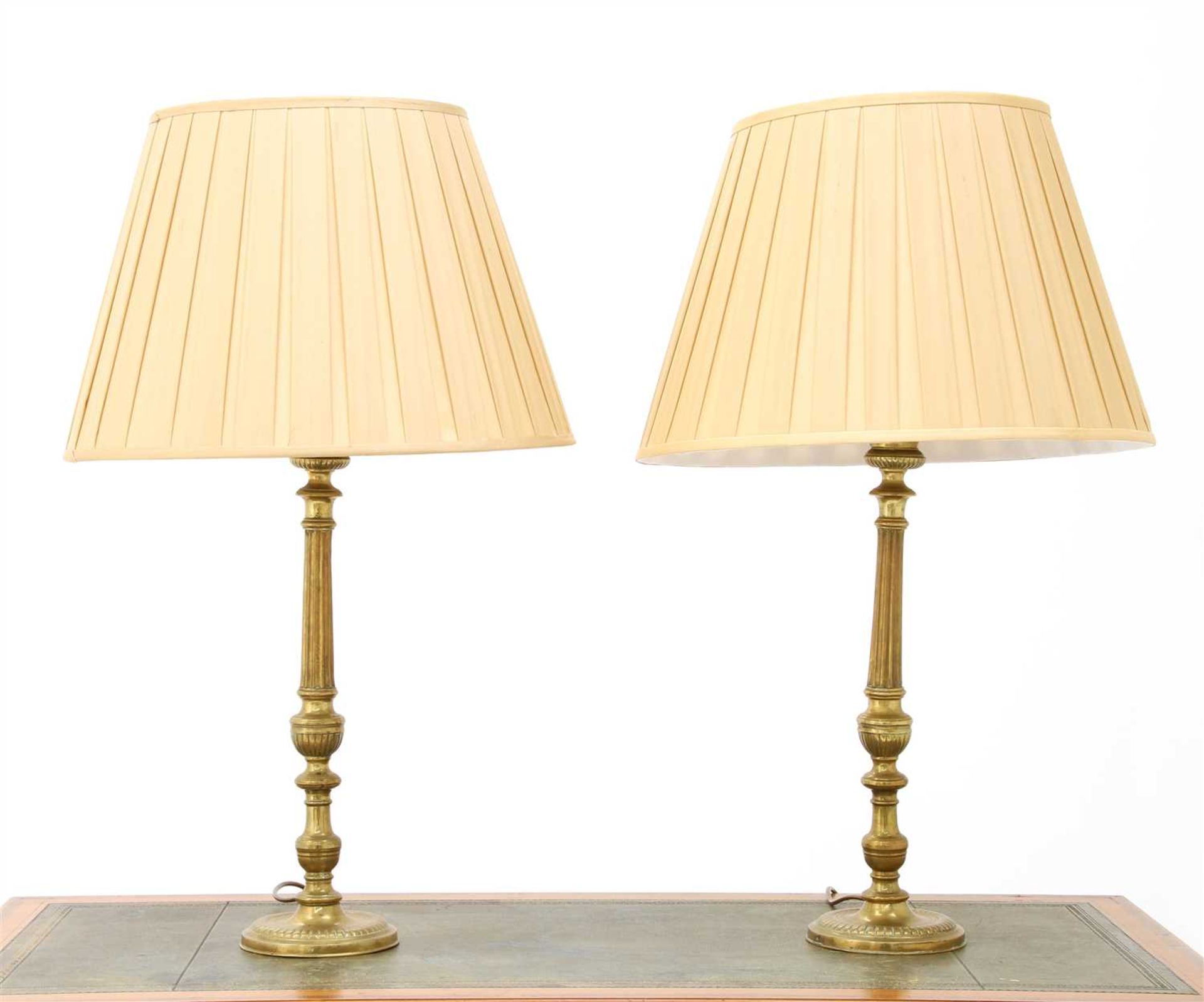 A pair of brass 'candlestick' table lamps,