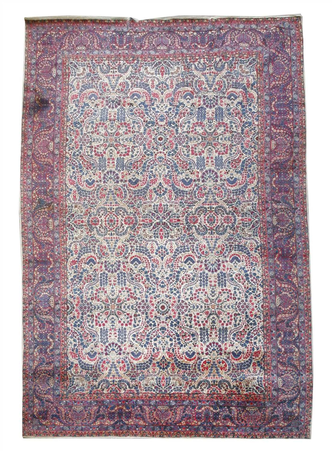 A large Kirman carpet,