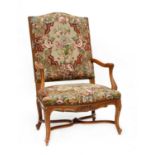 A Louis XV-style beechwood elbow chair,