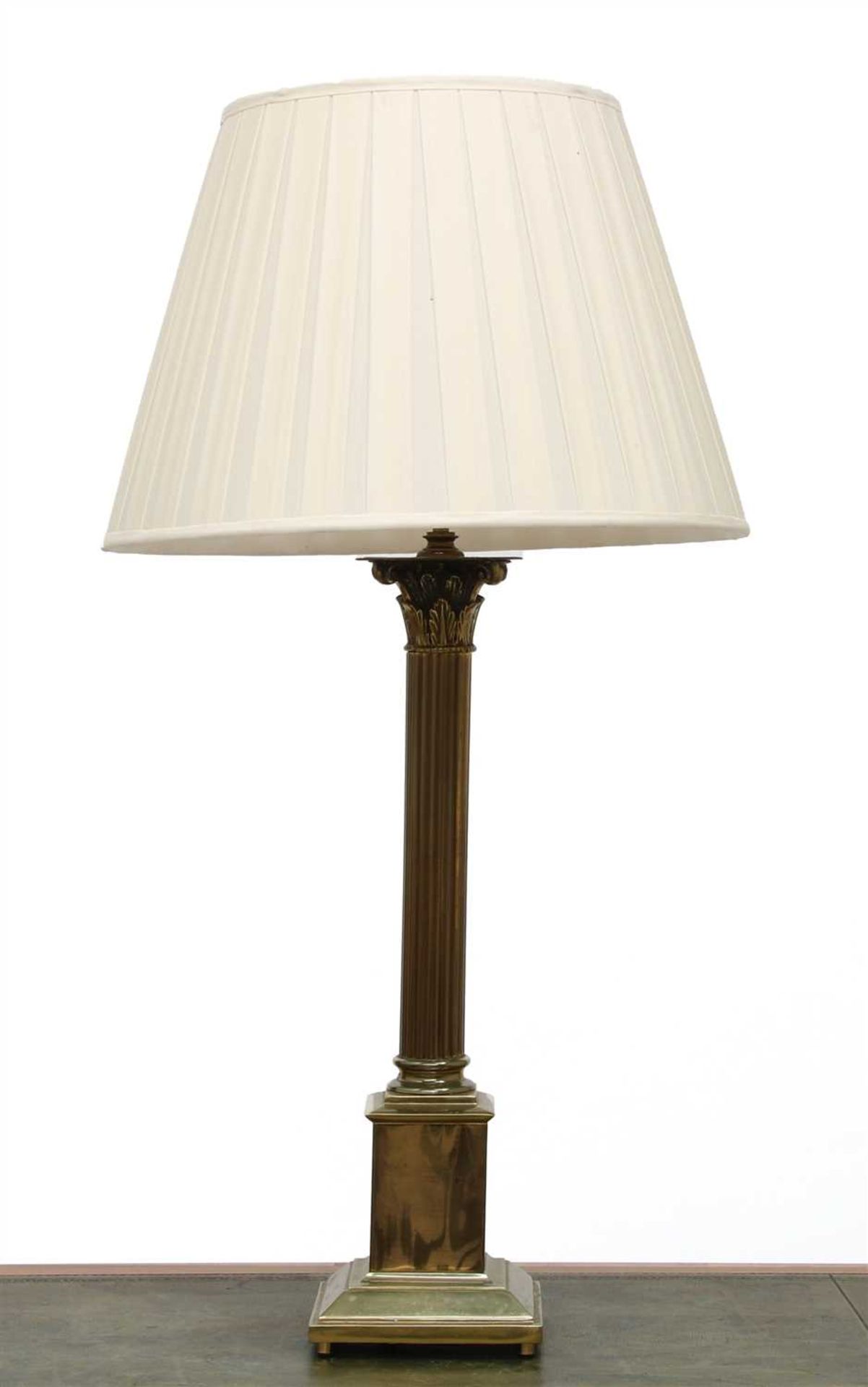 A large brass Corinthian column table lamp,