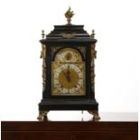 An Edwardian ebonised mantel clock,