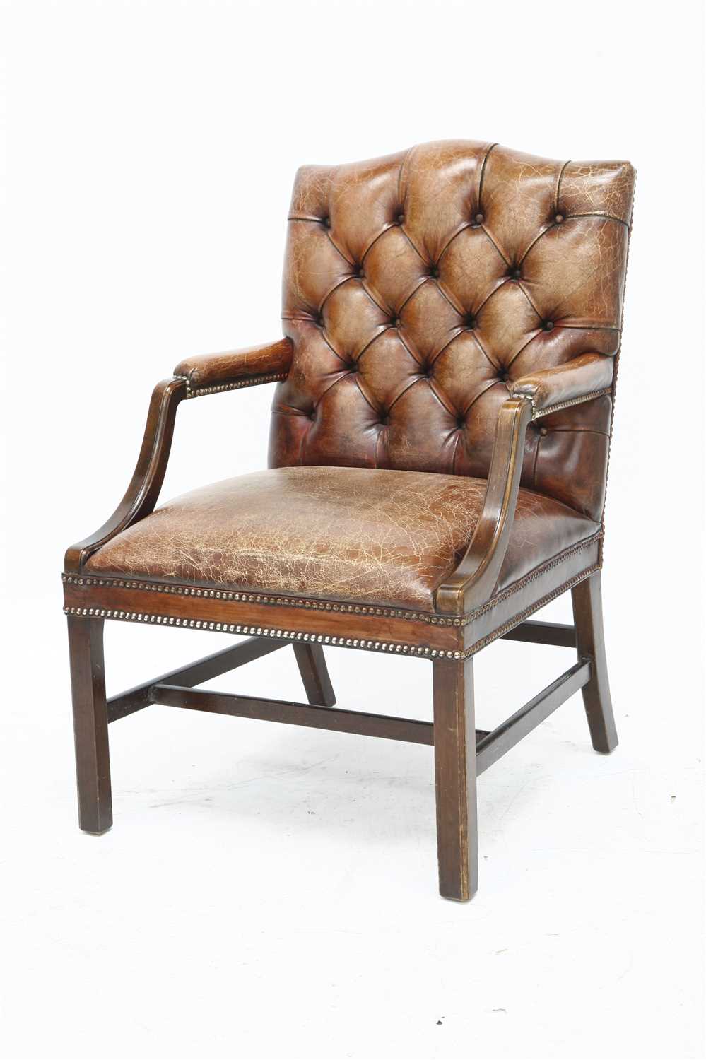 A brown leather office chair,