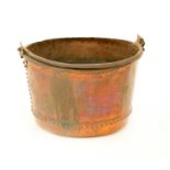 A large copper log basket,