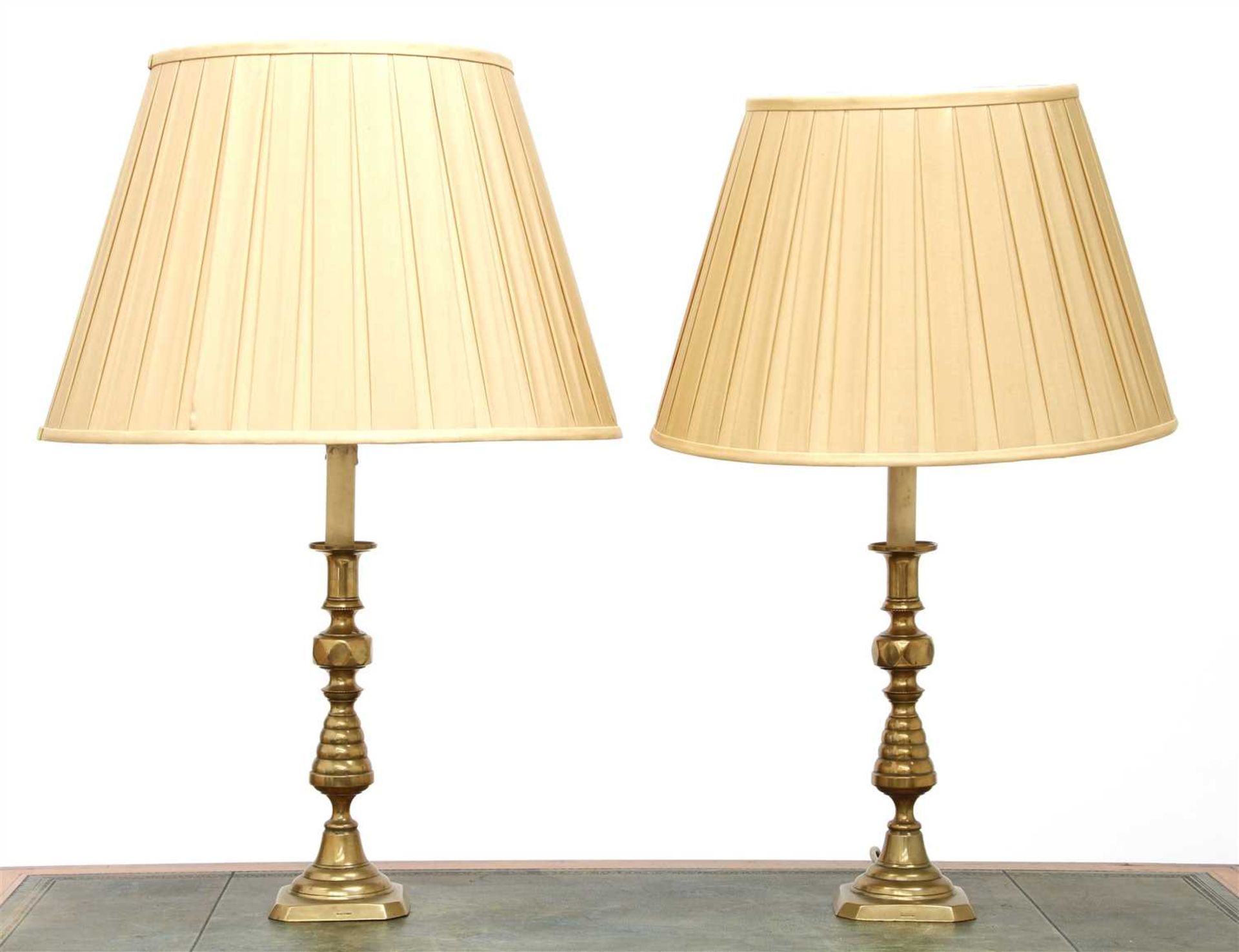 A pair of brass candlestick table lamps,