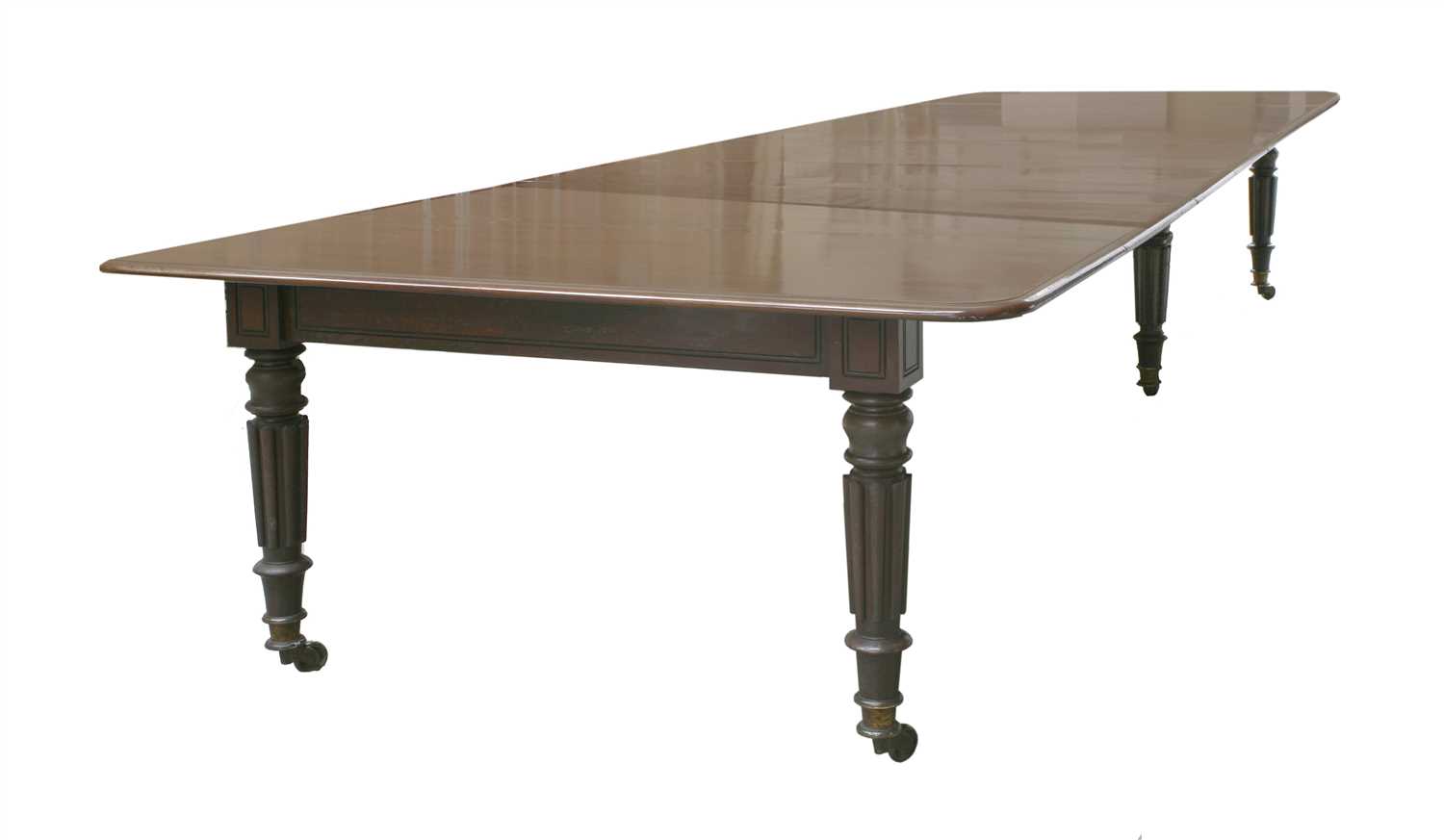 A mahogany extending dining table