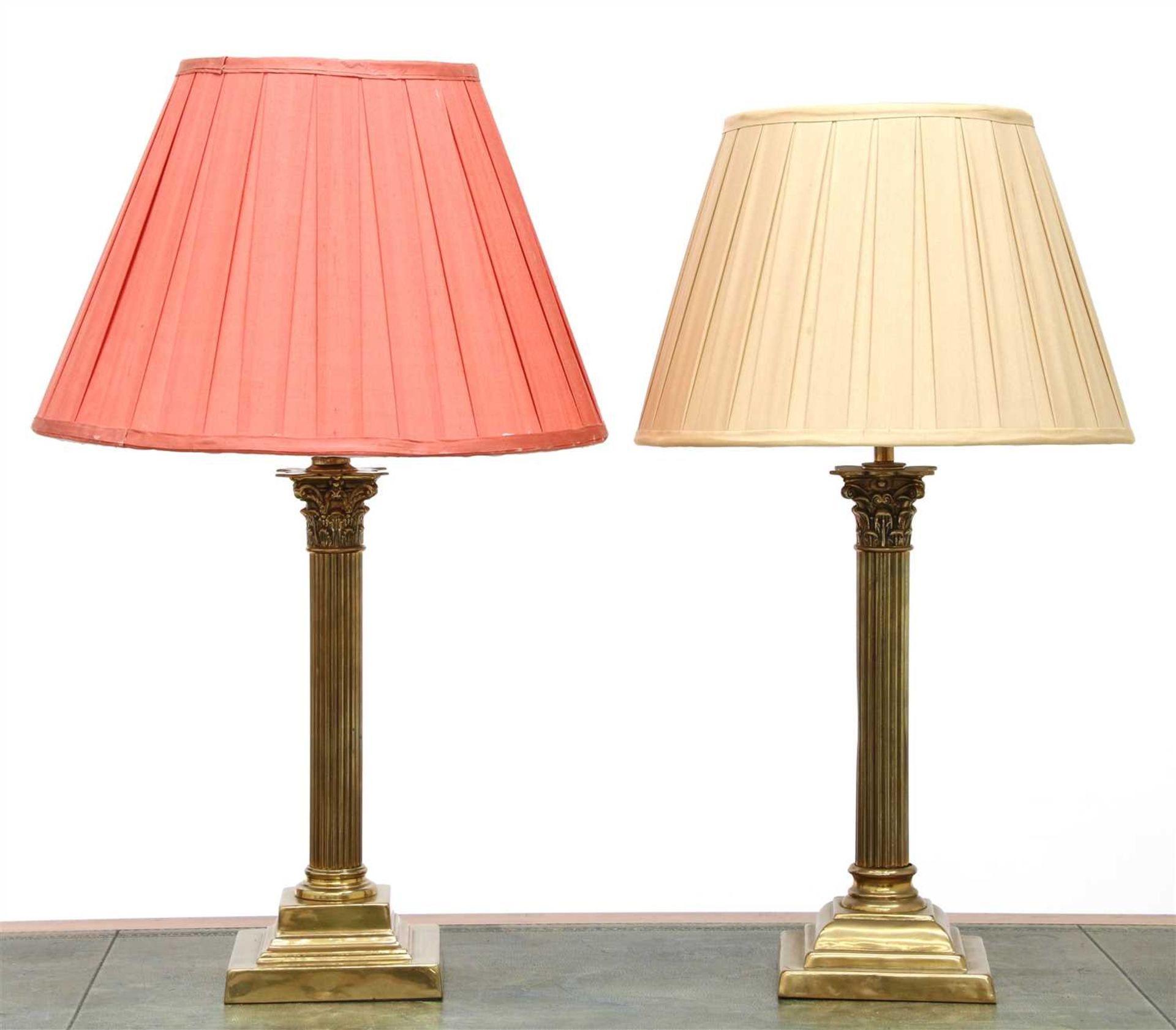 A pair of brass Corinthian column table lamps,