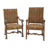 A pair of French walnut elbow chairs,