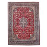 A large Kashan carpet,