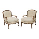 A pair of Louis XV-style open elbow chairs,