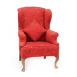 A wing armchair,