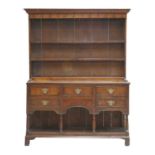 A George III oak pot-board dresser,