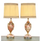 A pair of rouge veined marble table lamps,