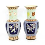 A large pair of Japanese vases,