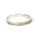 An 18ct white gold diamond set half eternity ring