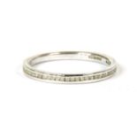 An 18ct white gold diamond set half eternity ring