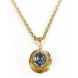 A 9ct gold and single stone synthetic spinel pendant on chain