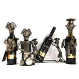 Four novelty metal bottle holders,