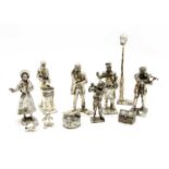 A collection of silvered figures,