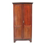 A 1920s mahogany bow front wardrobe